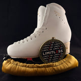 Gold Medalist blade soakers shown on a figure skate